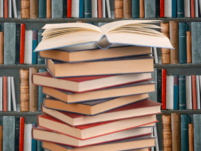 Open book in front of a bookcase