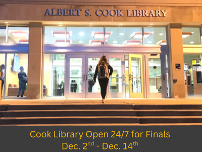 girl walking up stairs and into cook library 