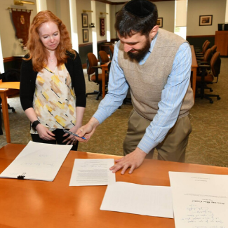 Professor Leshnoff with Archivist Todd-Diaz signing collections into the university archives